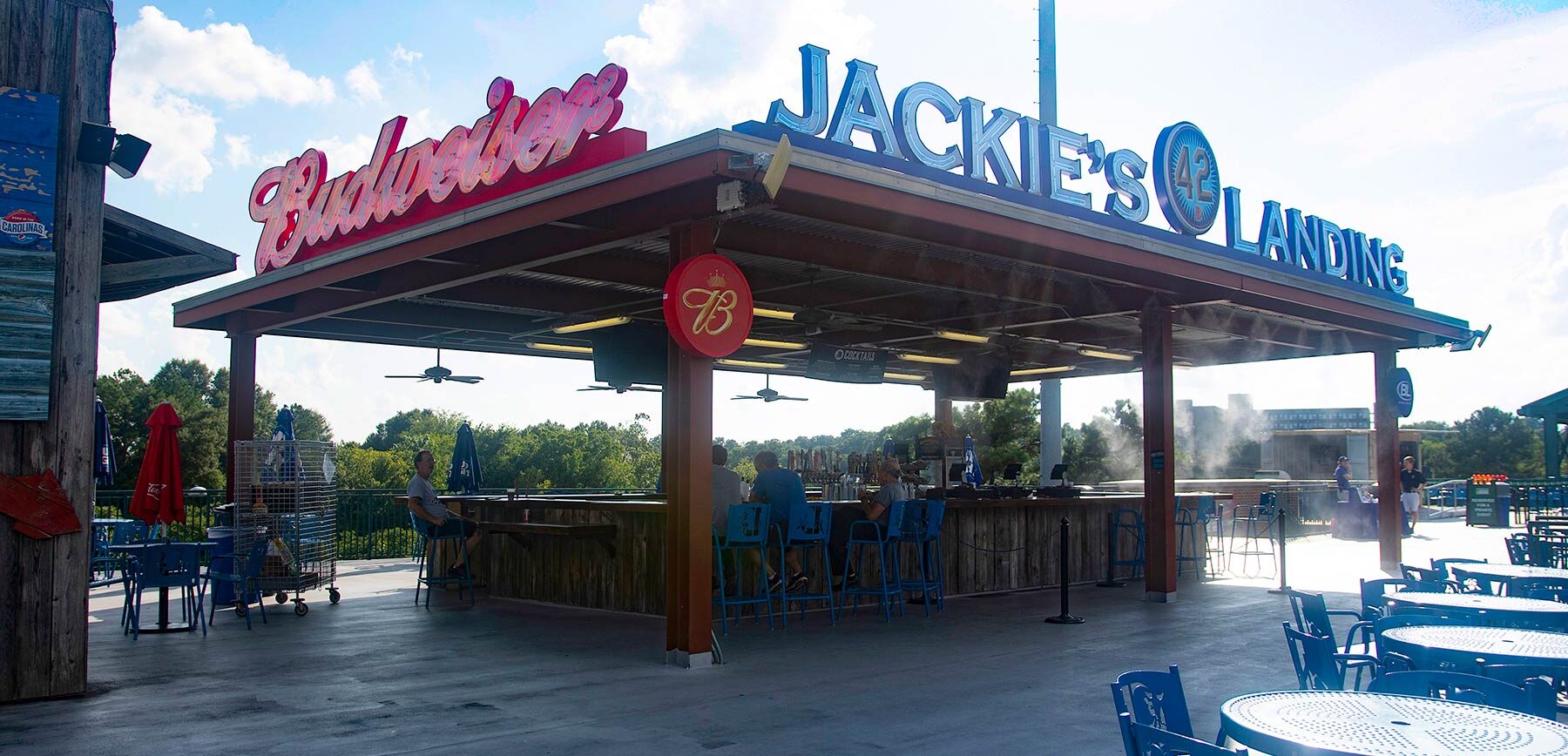 Photo of people sitting at Jackie's landing on the Outfield Concourse